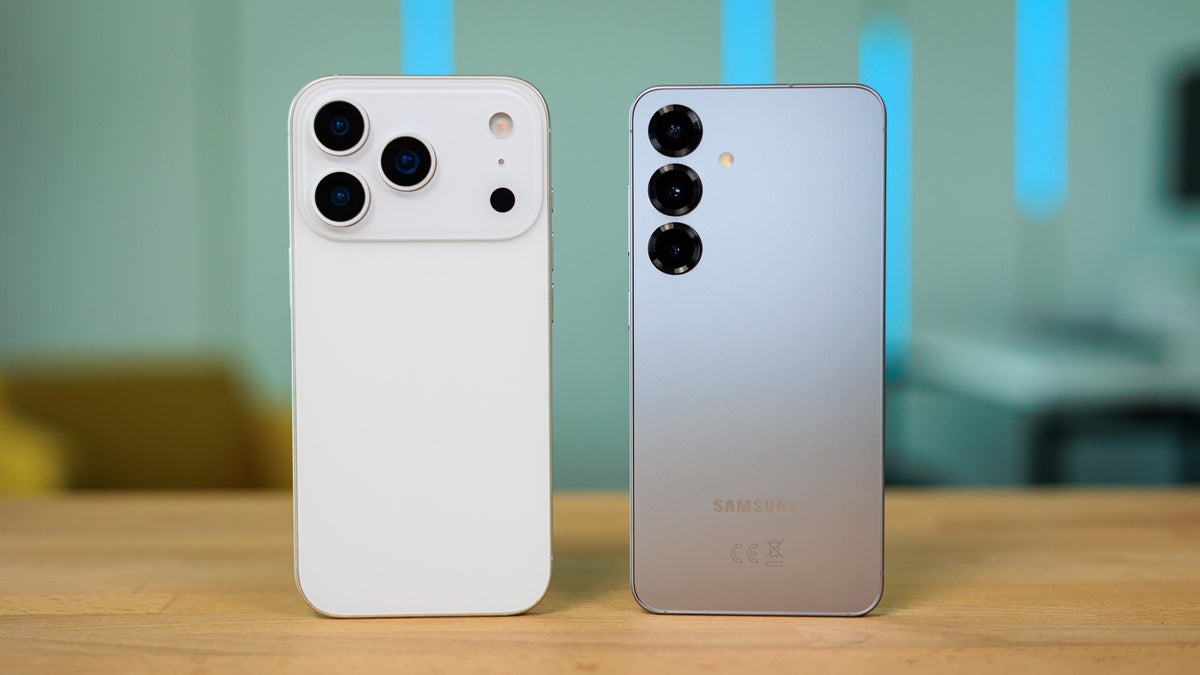 Back view of an iPhone and a Samsung Galaxy phone side by side, showcasing their camera designs.
