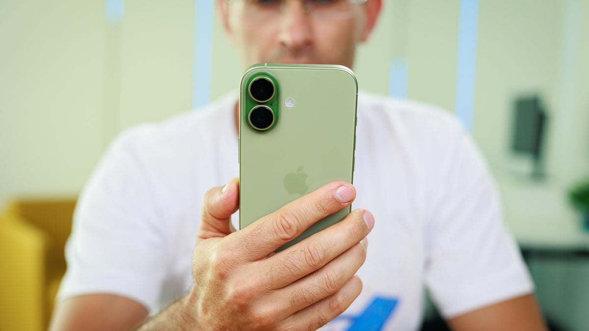 Person holding iPhone 17