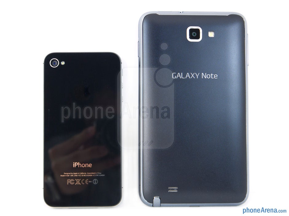 Backs - The Samsung Galaxy Note LTE (right) and the Apple iPhone 4S (left) - Samsung Galaxy Note LTE vs Apple iPhone 4S