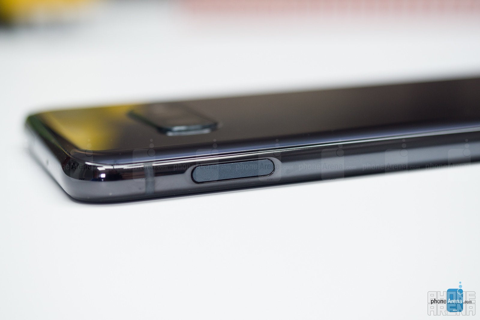 The traditional fingerprint reader on the side of the Galaxy S10e - Samsung Galaxy S10e vs Apple iPhone XR