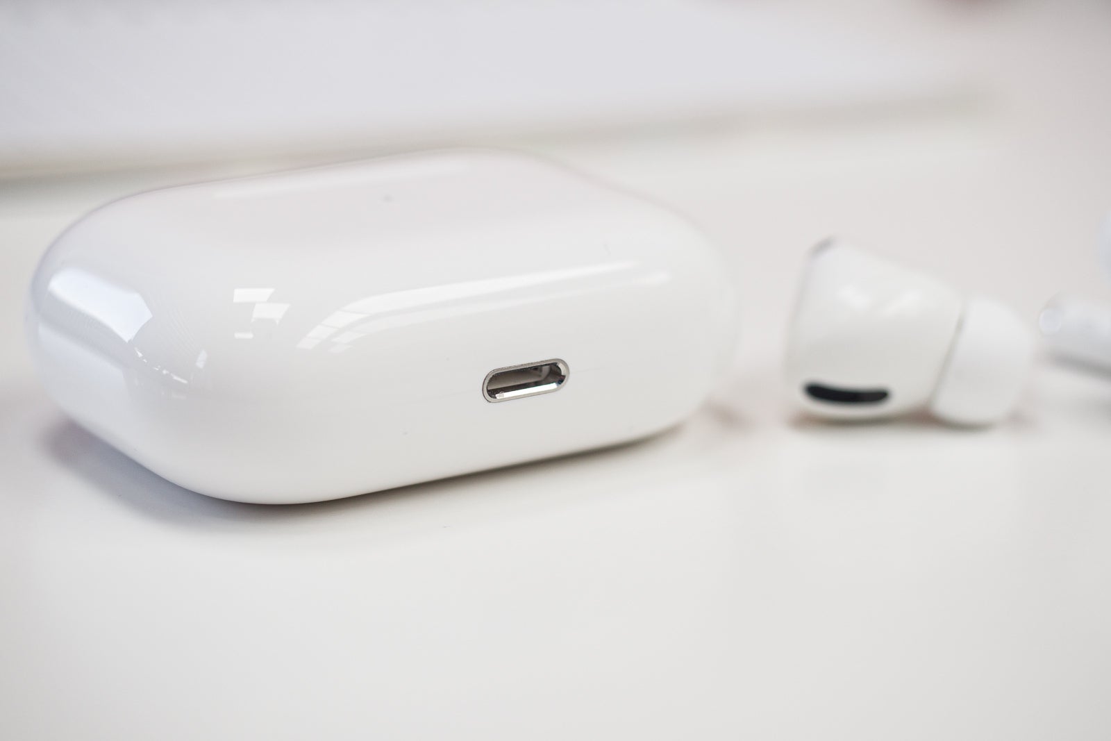 The AirPods Pro case (shown here) charges via Lightning, while the Buds Live case uses USB Type-C - Galaxy Buds Pro vs AirPods Pro