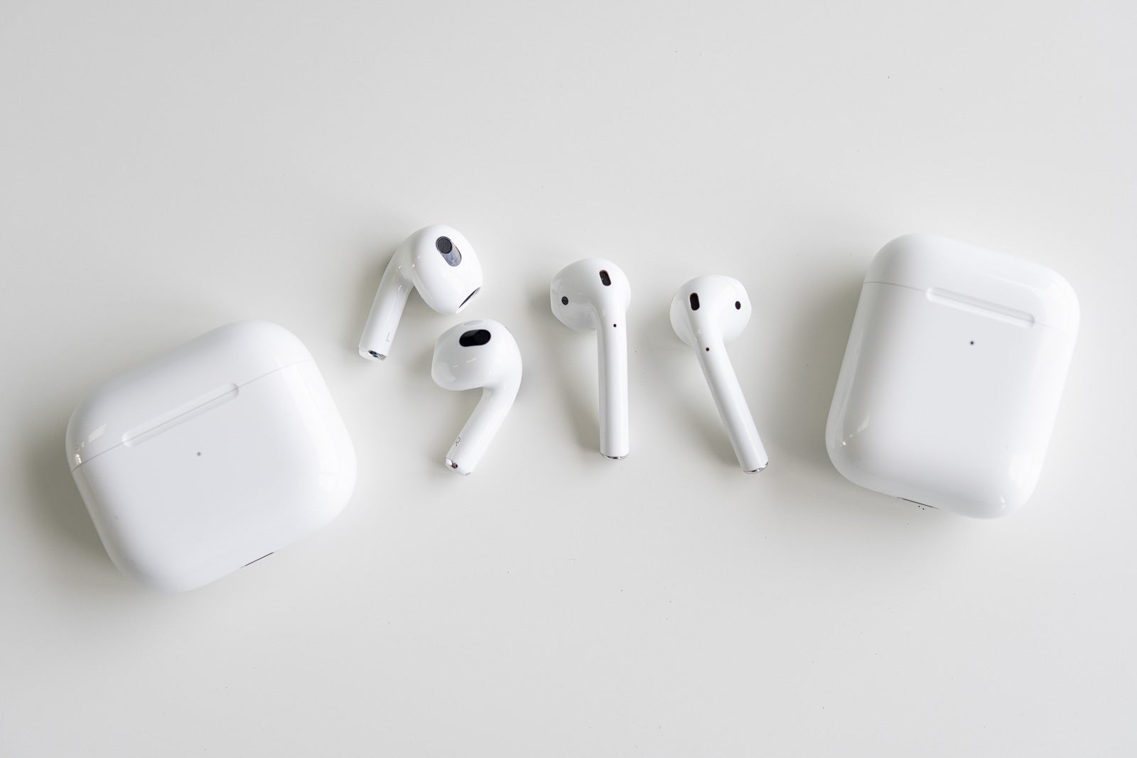 The AirPods 3 (left) and AirPods 2 (right) - AirPods 3 vs AirPods 2: Visible evolution
