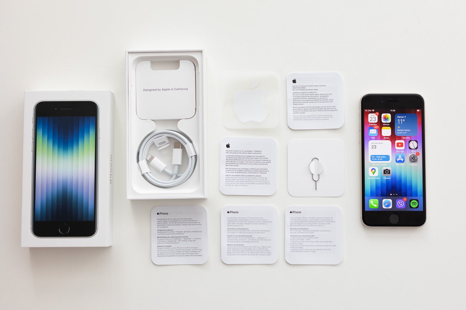 That's a lot of user manuals, a cable, but no charger in the box - iPhone SE 3 Review: déjà vu