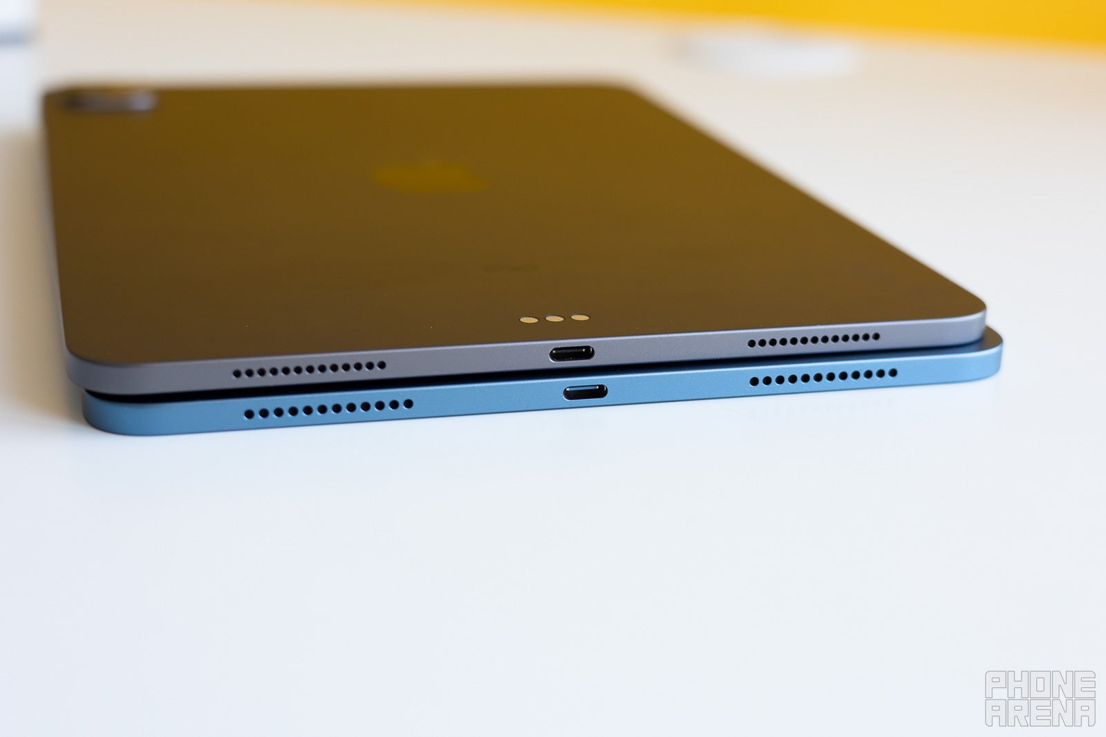 iPad Air 5 - bottom, iPad Pro - top; both charge via a USB Type-C port on the bottom - iPad Air (2022) vs 11-inch iPad Pro (2021): Save your money