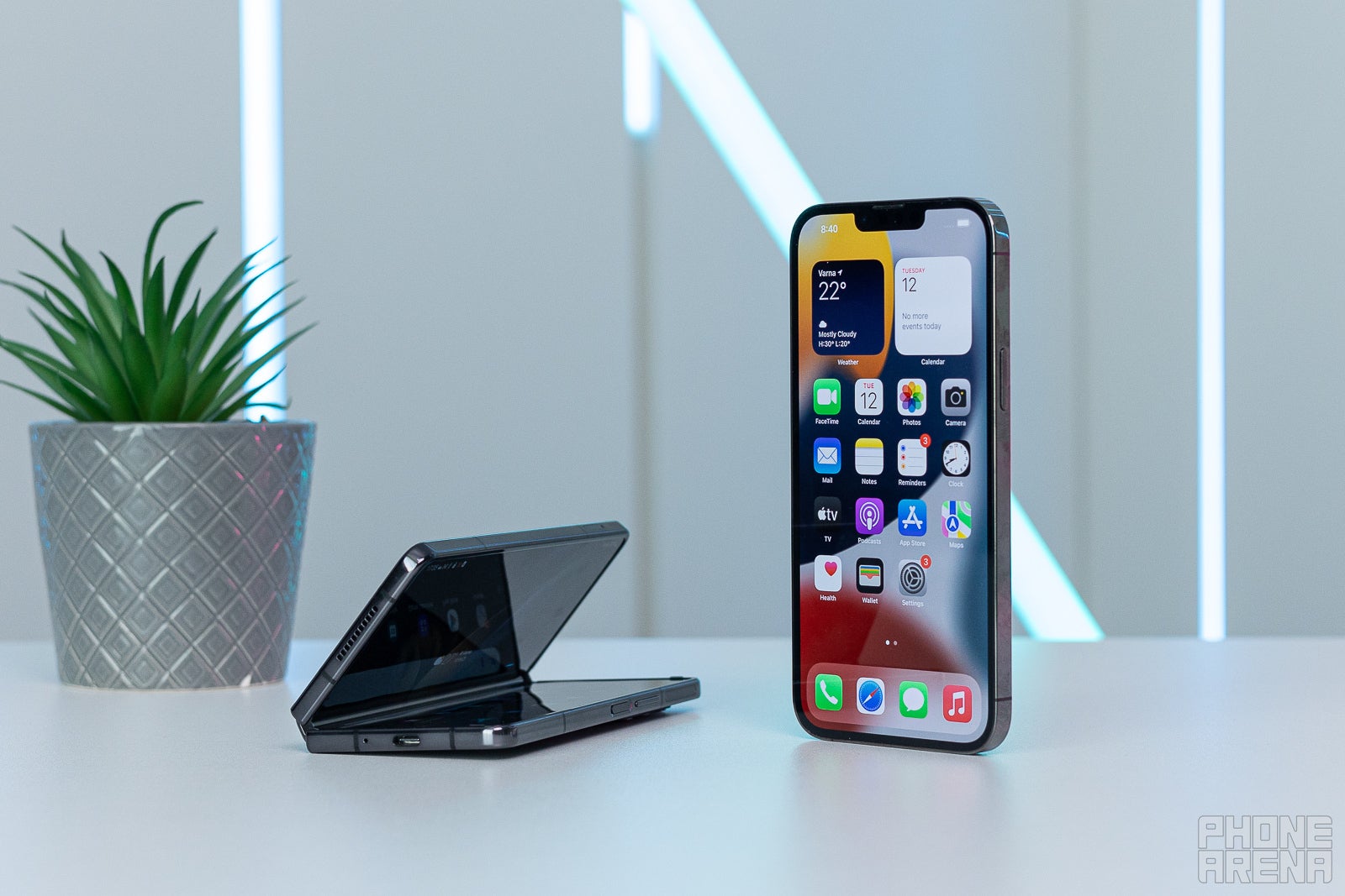 (Image Credit - PhoneArena) Folding it up makes it chunky - Samsung Galaxy Z Fold 4 vs iPhone 13 Pro Max