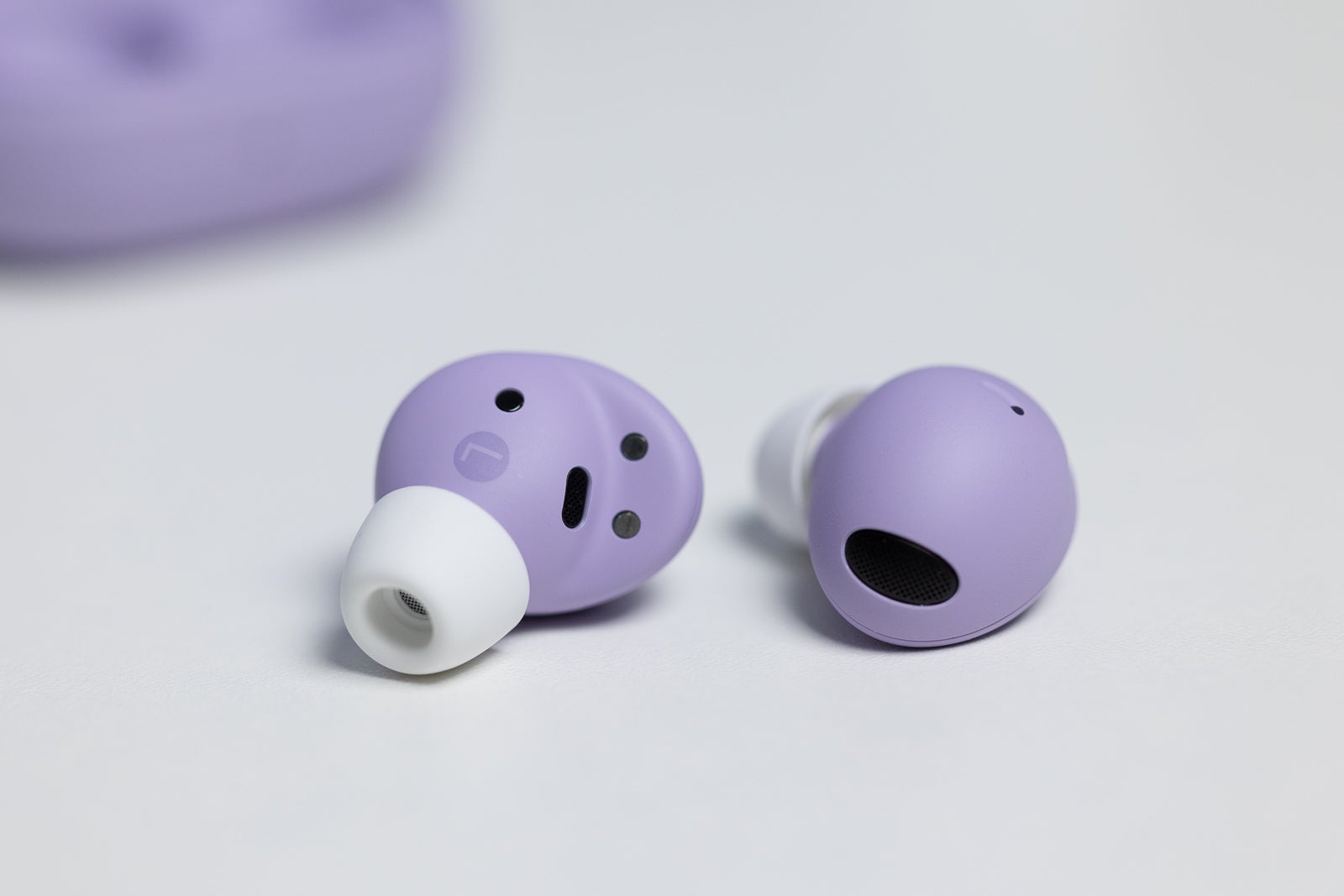(Image credit - PhoneArena) Galaxy Buds 2 Pro earbuds, close up - Galaxy Buds 2 Pro review: Sleeker design, but is it worth the price jump?