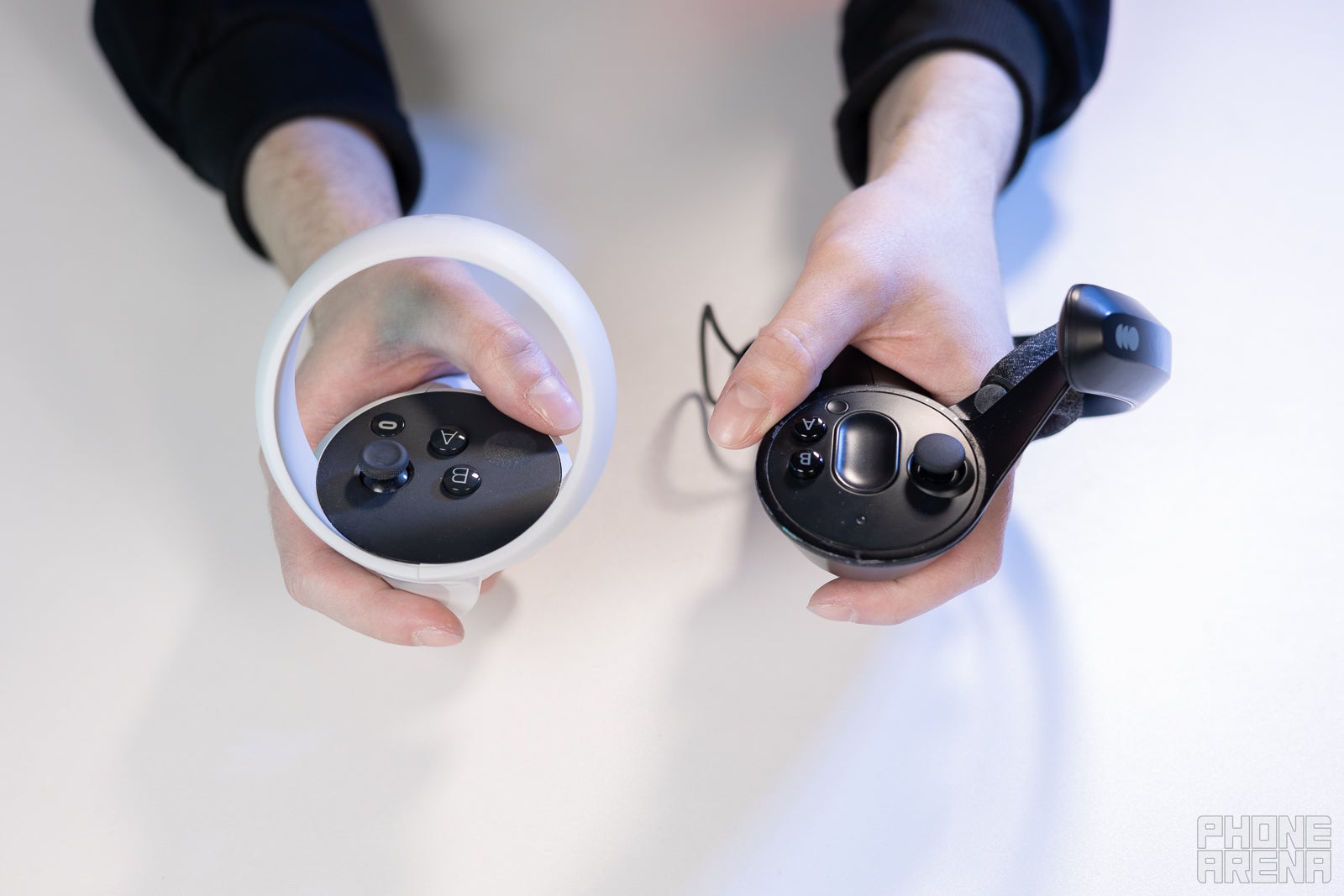 (Image Credit - PhoneArena) Top-down view of the controllers - Meta Quest 2 vs Valve Index: Meta is just on another level with its virtual reality headsets