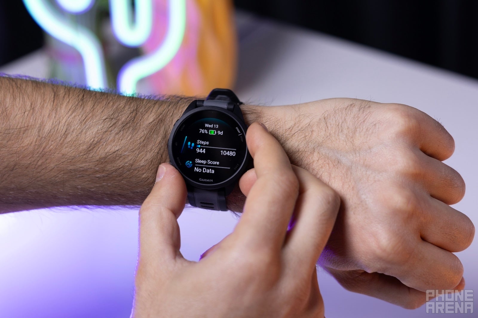 Swipe up and down (or use the up-down buttons) to view different Glances in GarminOS (Image by PhoneArena) - Garmin Forerunner 165 Review: The new default Garmin sports watch