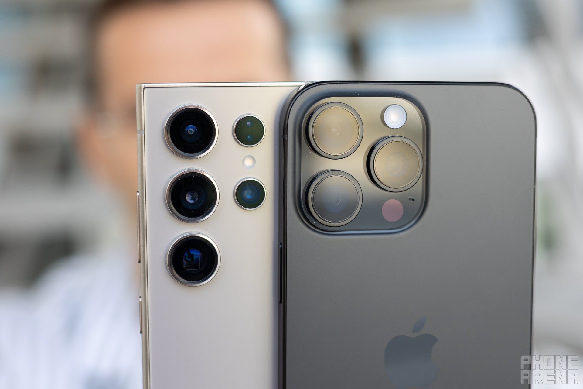 A close-up picture of the camera modules on the iPhone 16 Pro Max and the Galaxy S24 Ultra