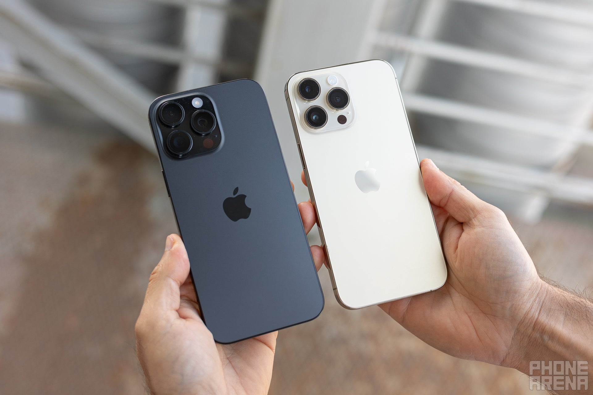 The back sides of the Apple iPhone 16 Pro Max next to the iPhone 14 Pro Max