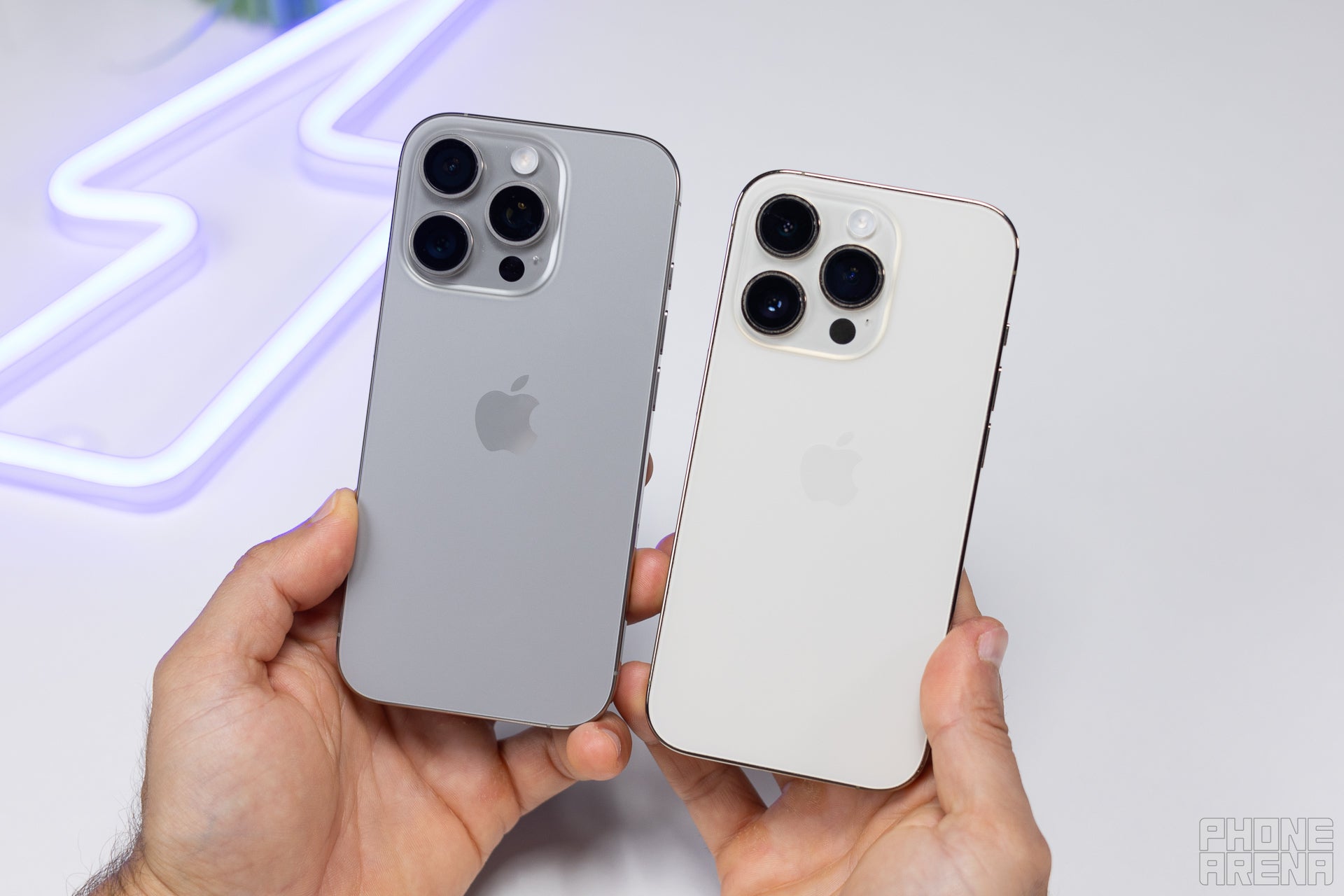 iPhone 16 Pro (on the left) has a similar size to the 14 Pro, but a bigger screen (Image by PhoneArena) - iPhone 16 Pro vs iPhone 14 Pro: What has changed?