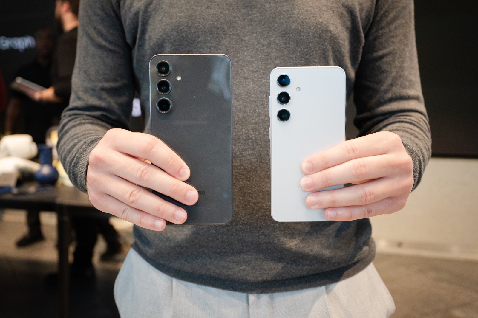 A person holding the S24 FE and S24 next to each other.