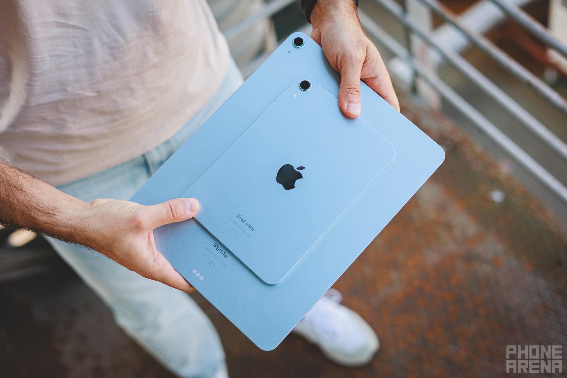 Person holding iPad mini and the iPad Air 13&amp;quot; overlaid on top of each other showing how small the mini is