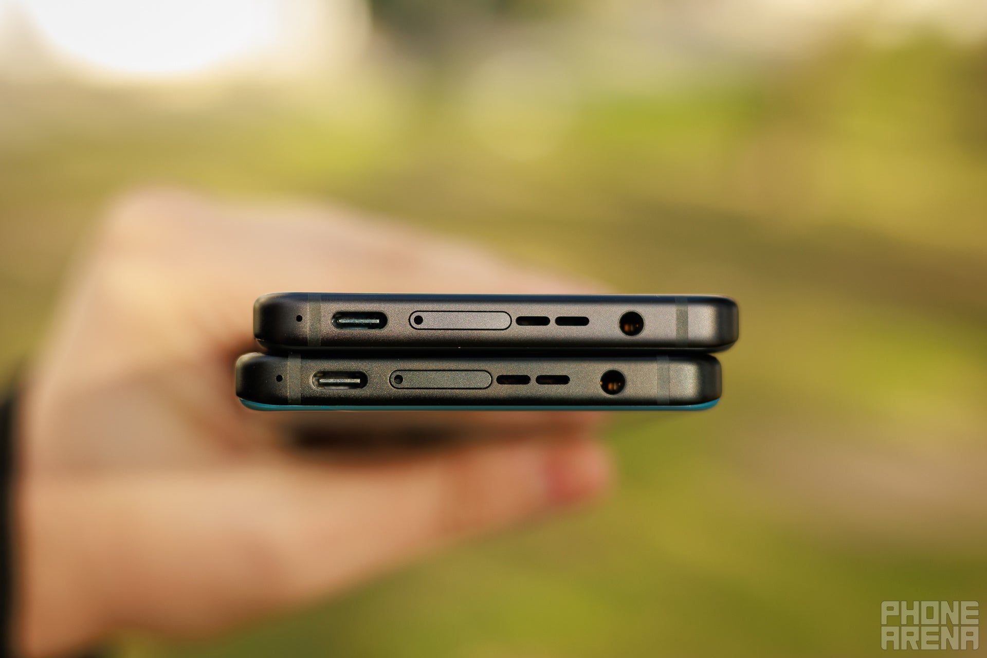 Bottom view of the Zenfone 12 Ultra and Zenfone 11 Ultra showing that the USB C port, headphone jack, speaker grille are in the same position