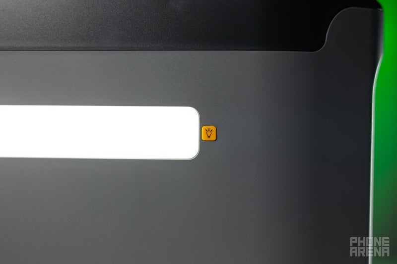 Close-up of the Vtoman FlashSpeed 1500's LED light button.