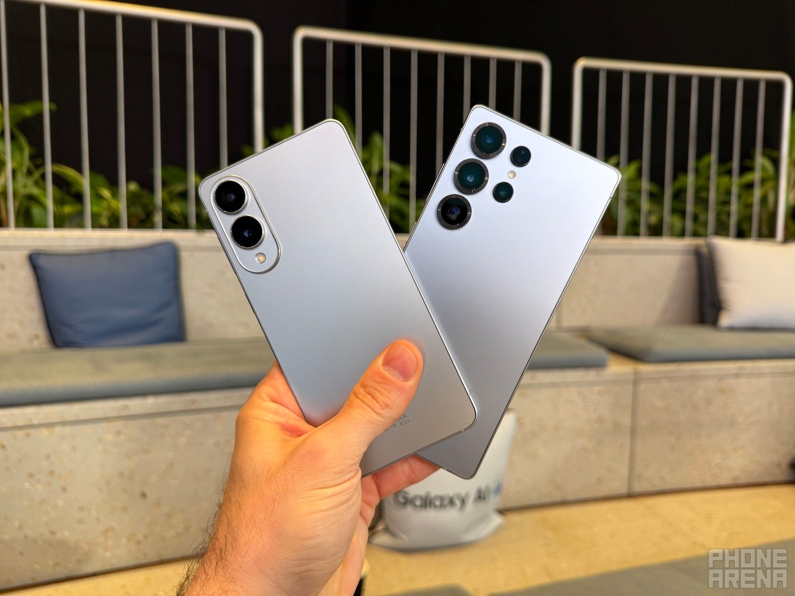 Galaxy S25 Edge and S25 Ultra held in hand, backs towards the camera