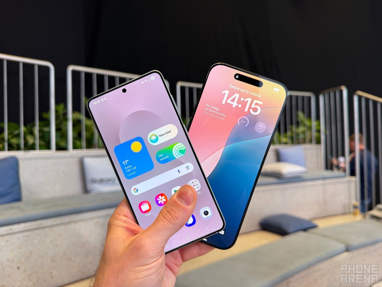 Galaxy S25 Edge and iPhone 16 Pro Max held in hand, displays are on and towards the camera