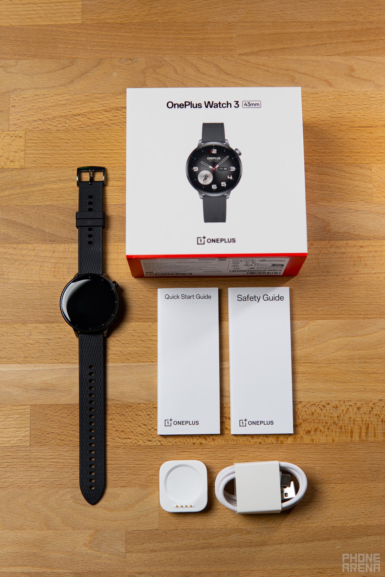 OnePlus Watch 3 43mm and its accessories (Image by PhoneArena) - OnePlus Watch 3 43mm Review: The compact battery champ