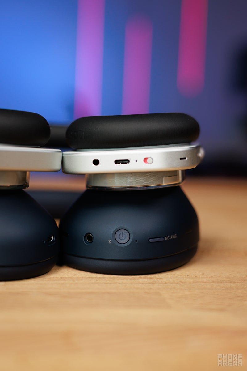 Nothing Headphone (1) and Sony WH-1000XM6 laying on their sides, showing the buttons and controls on the headphones