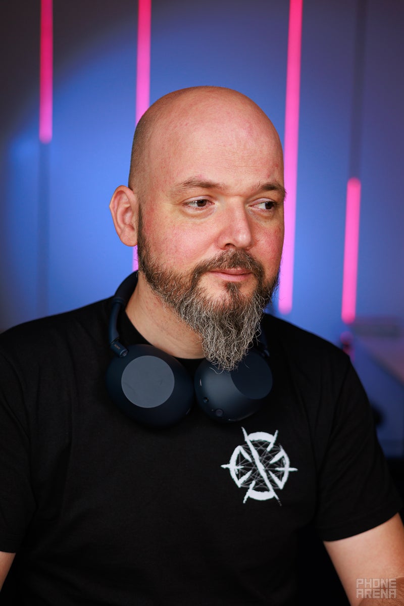 Sony WH-1000XM6 hanging over a person's neck
