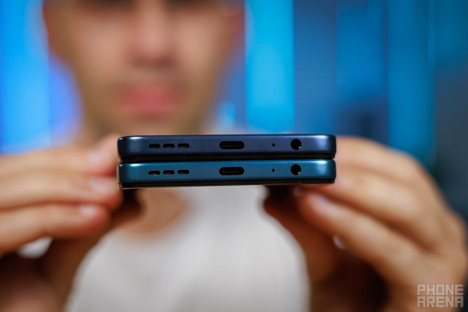 Bottom edge comparison of Moto G Play (2026) and Moto G (2026) with ports and speakers.