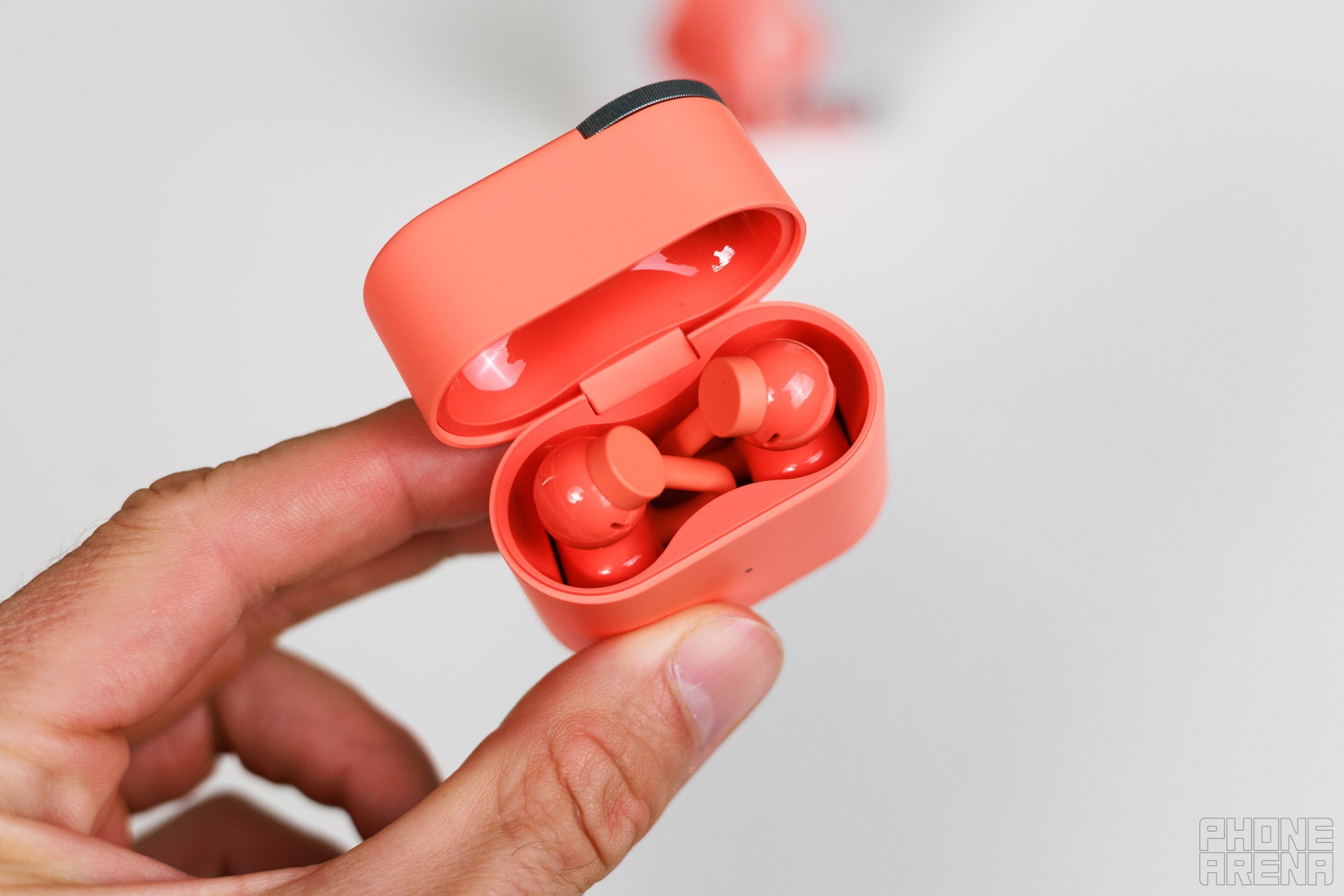 Not going to lie, putting them back in the case has a learning curve to it | Image by PhoneArena - Nothing's CMF Clip Pro buds: Nothing knows audio ball