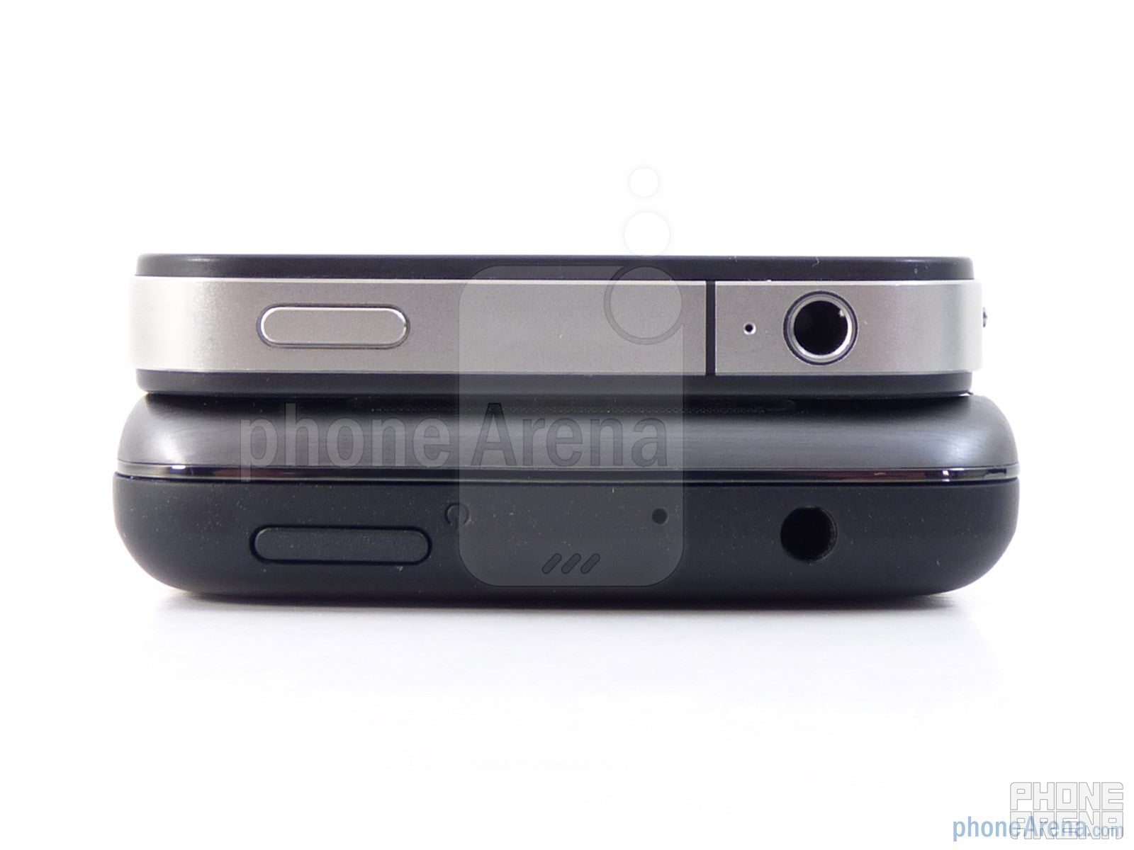 3.5mm jacks and power buttons are on the top edges of both devices - HTC Surround vs Apple iPhone 4