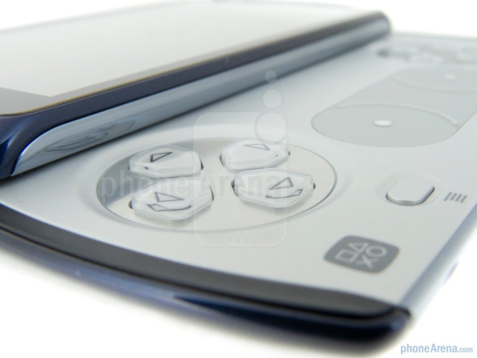 Sliding up the handset to reveal its PlayStation fashioned gaming pad - Sony Ericsson Xperia PLAY 4G Review